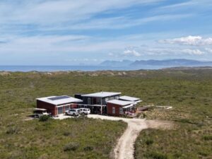 Walkerbay Dunes Lodge with Walker Bay in the background